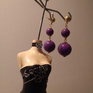 Pair of gold toned and purple earrings